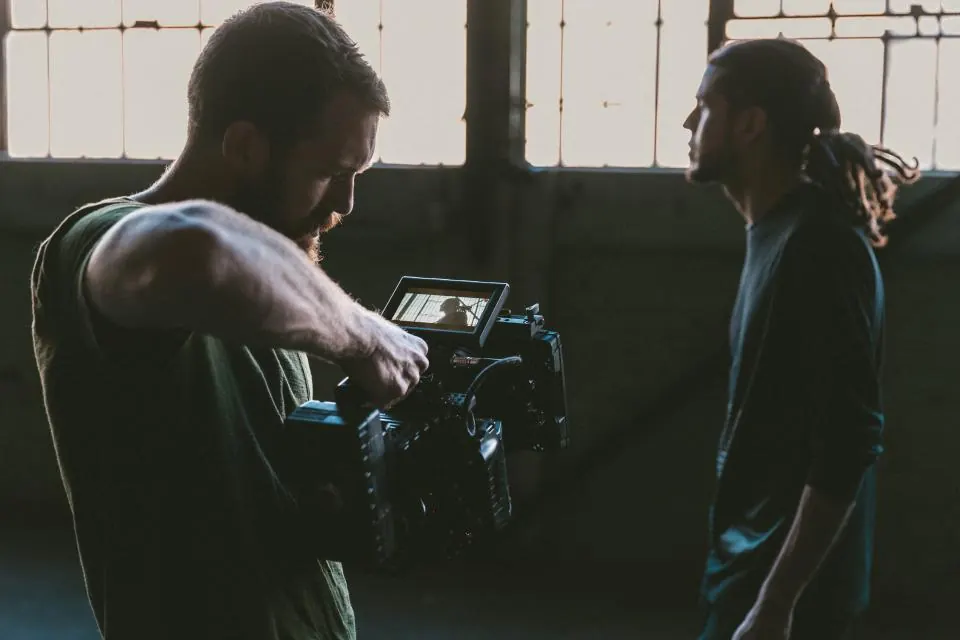 Creative production: a crew filming a promotional film with a camera